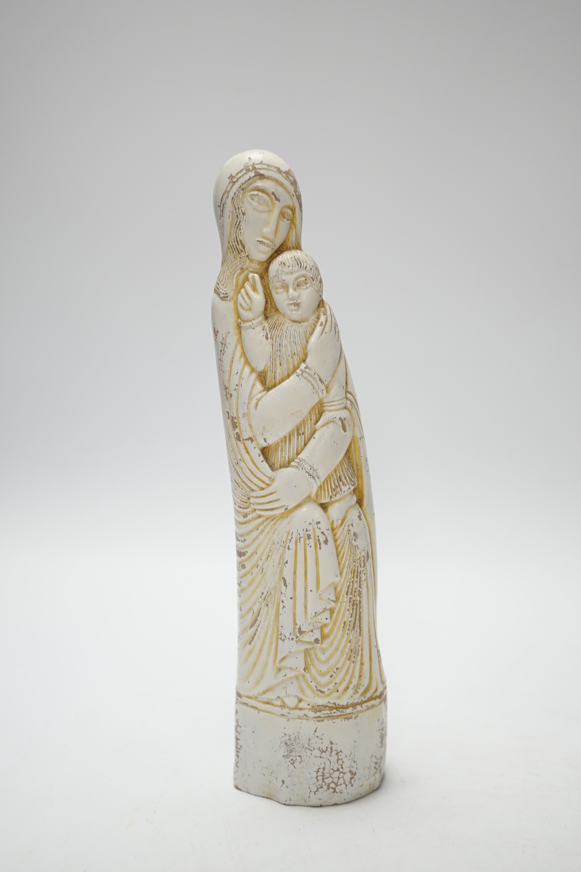 An Eric Gill sculpture of Madonna and child and a carriage timepiece, sculpture 23cm high